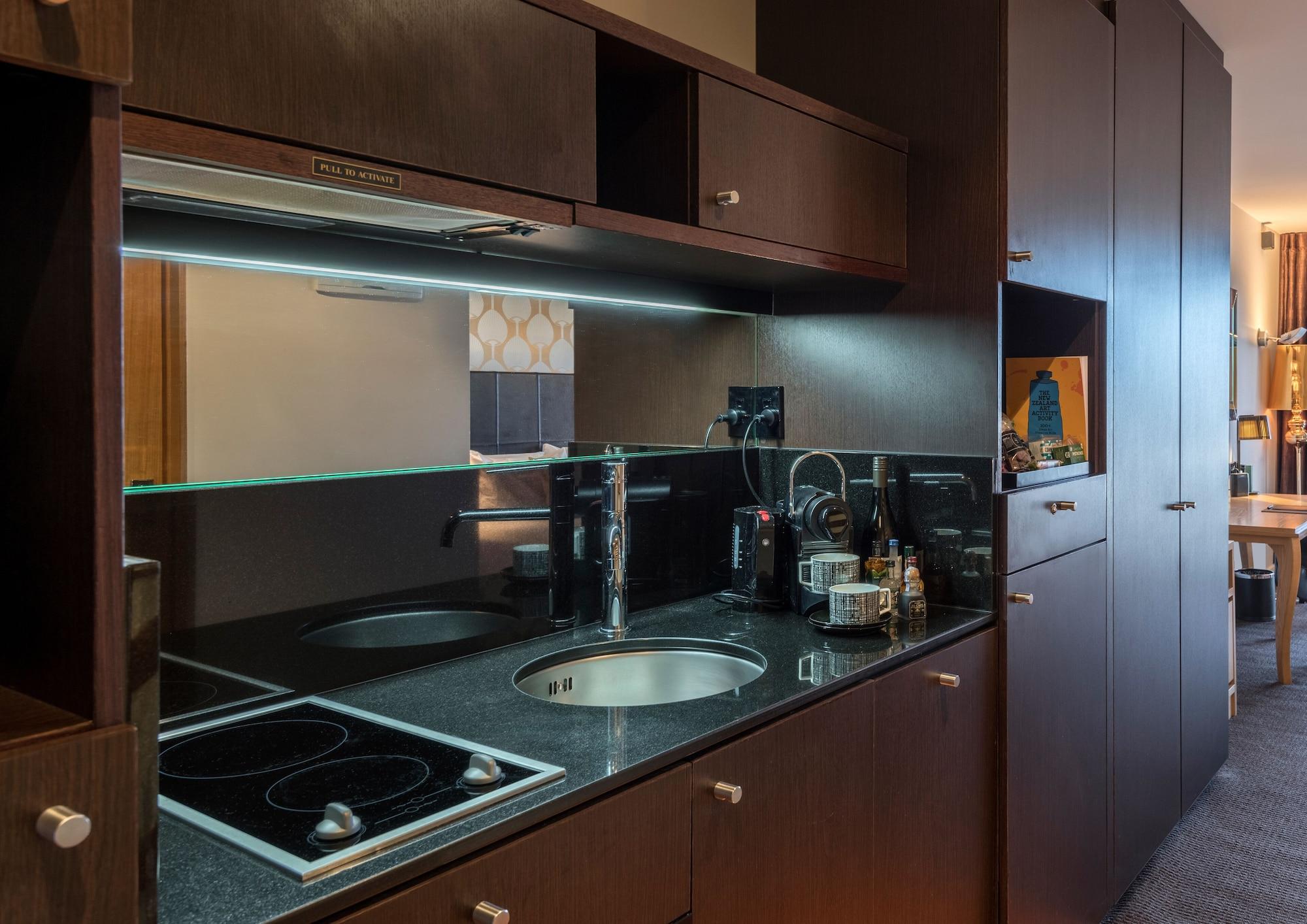 Qt ウエリントン アパートメンツ ウェリントン エクステリア 写真 A kitchen in a serviced apartment