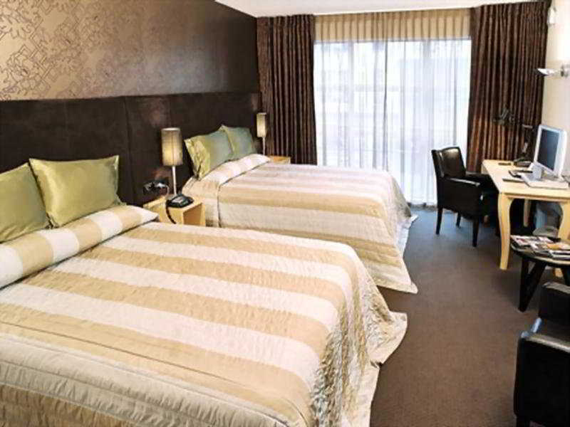 Qt ウエリントン アパートメンツ ウェリントン エクステリア 写真 A typical room at the hotel